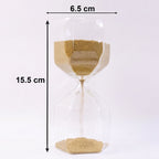 Sand flowing smoothly in glass hourglass timer