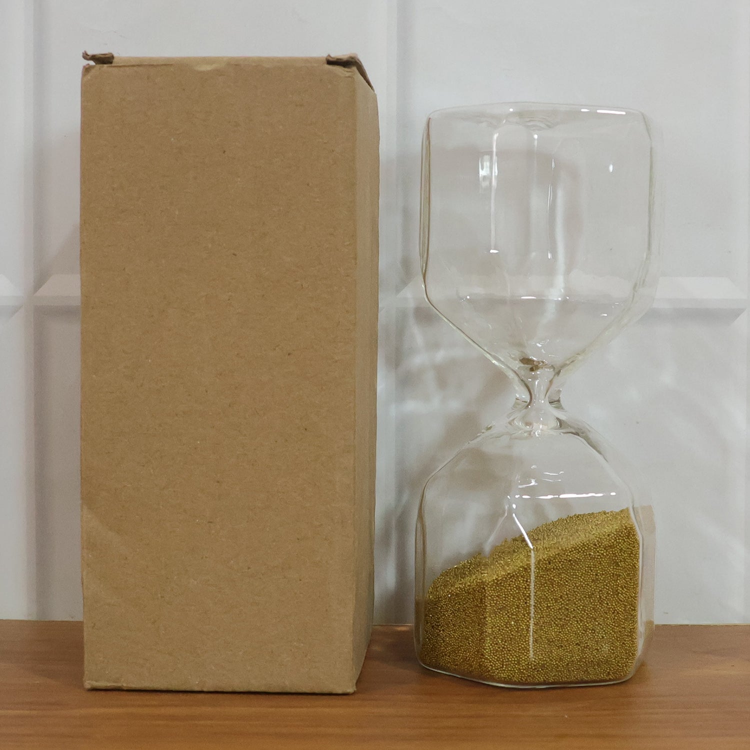 Glass sand timer hourglass on white background