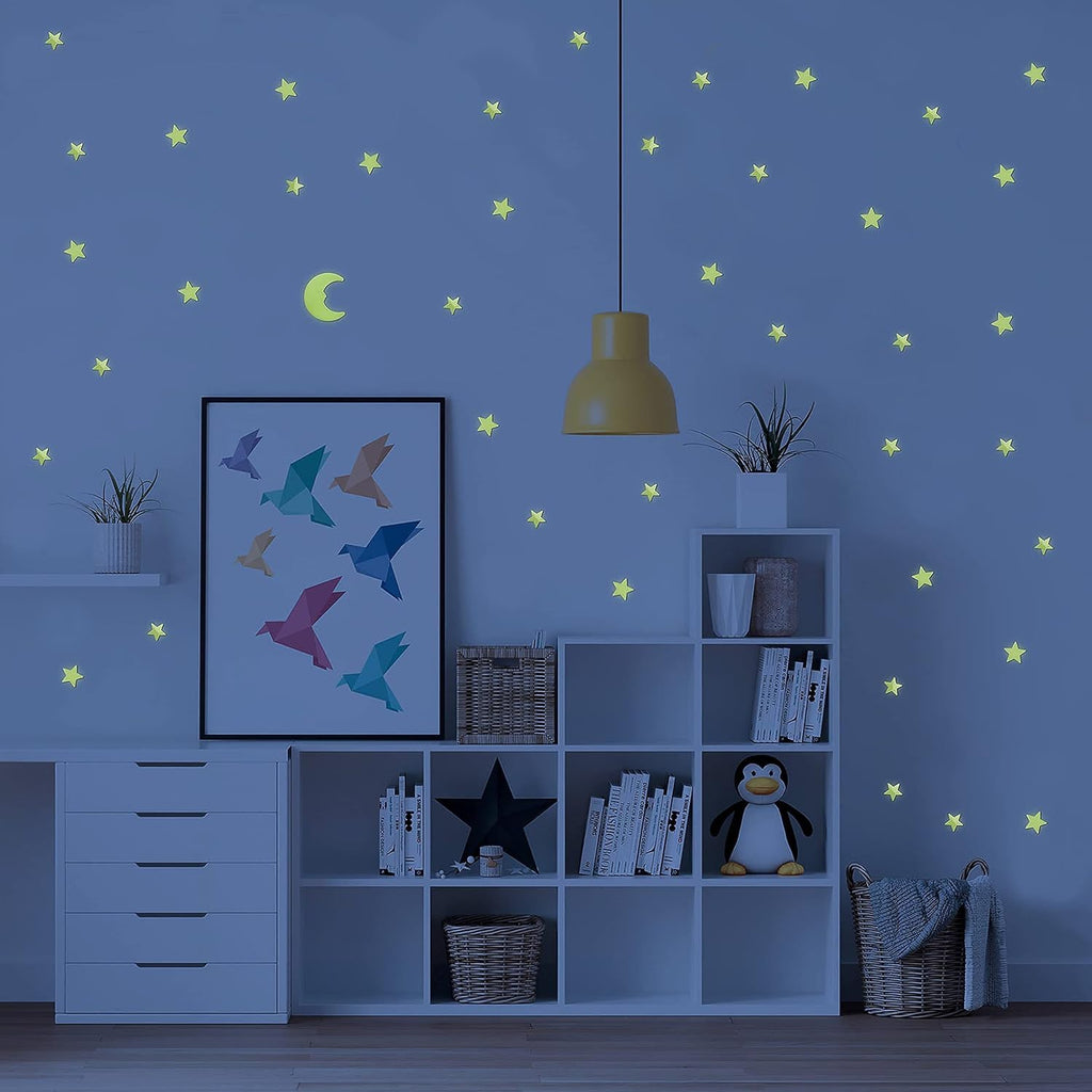 Close-up view of a luminous star wall decal, showing its bright glow in a dark room.