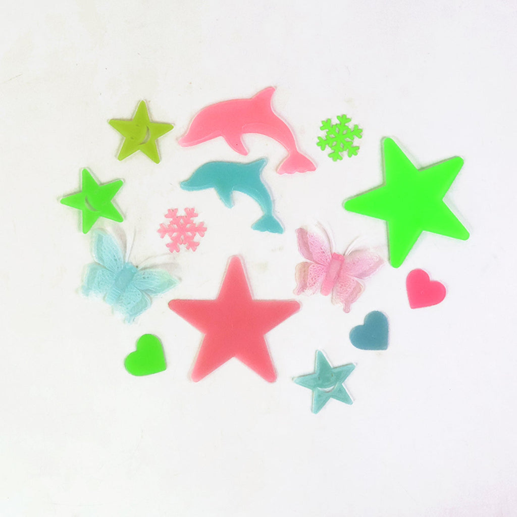 A cozy kids' bedroom beautifully decorated with luminous stars and moon decals, creating a peaceful ambiance.