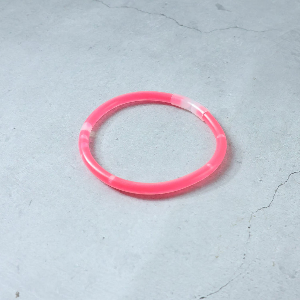 Person enjoying a concert while wearing a bright Glow LED Bracelet.