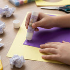 Smooth application of solid glue stick on paper for crafts