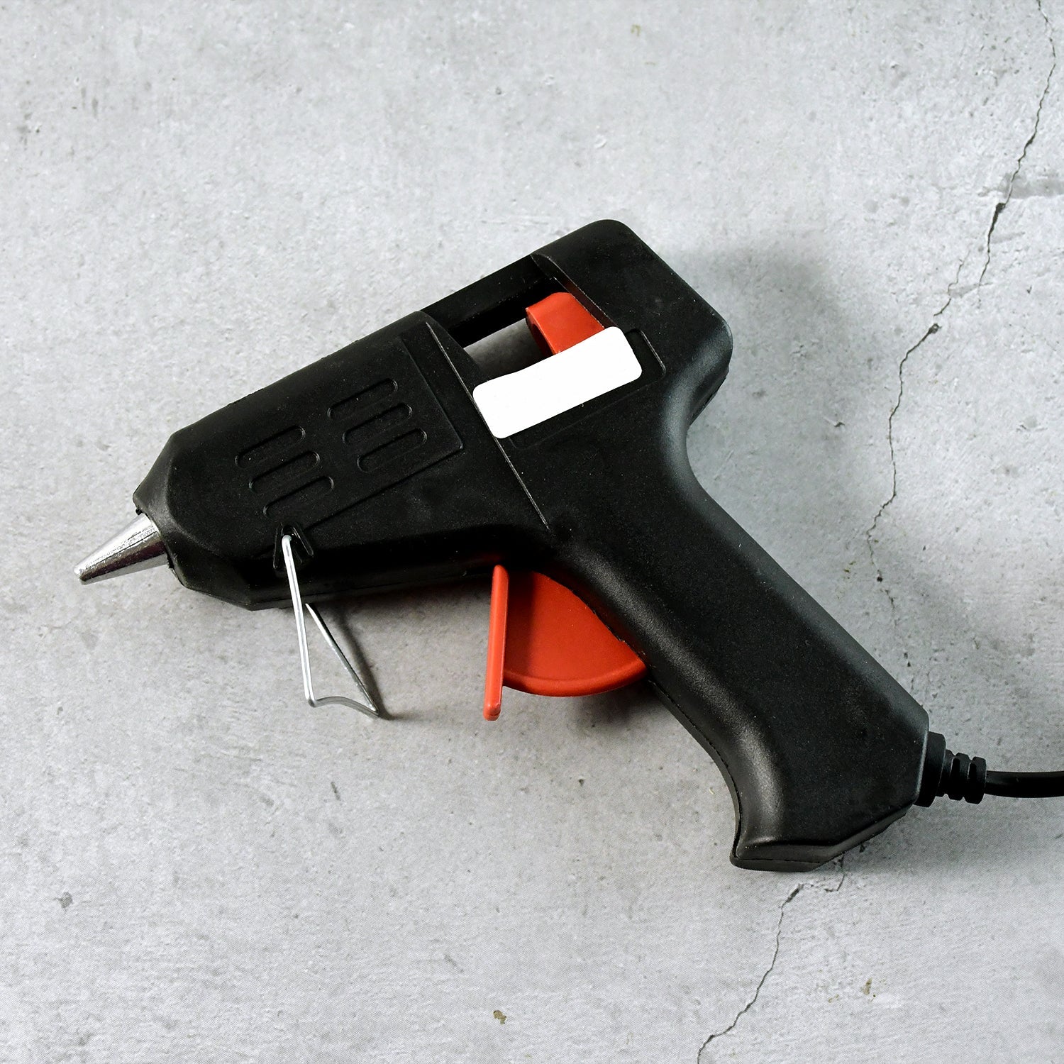 Side angle of electric 20W hot melt glue gun with fold-out stand