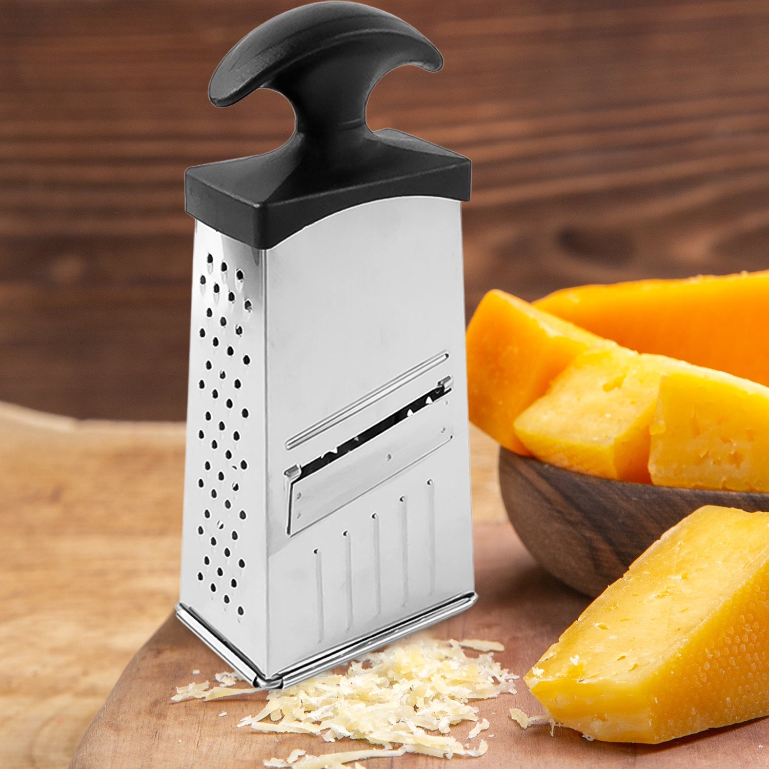 All-in-one stainless steel grater and slicer tool featuring easy grip handle