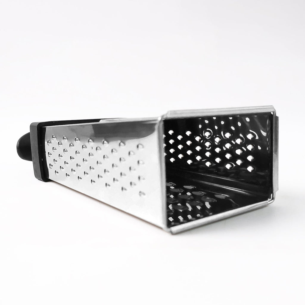 Fine and coarse grater surfaces of stainless steel 4-in-1 grater with handle