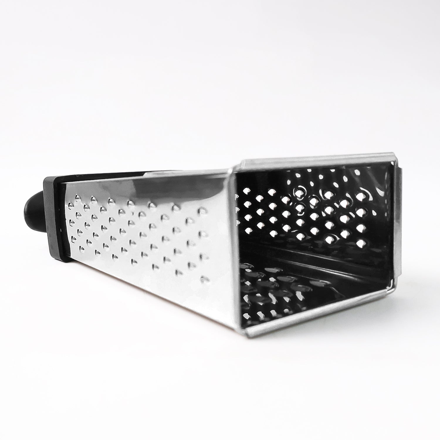 Fine and coarse grater surfaces of stainless steel 4-in-1 grater with handle