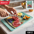 Flat view of green cutting board with handle