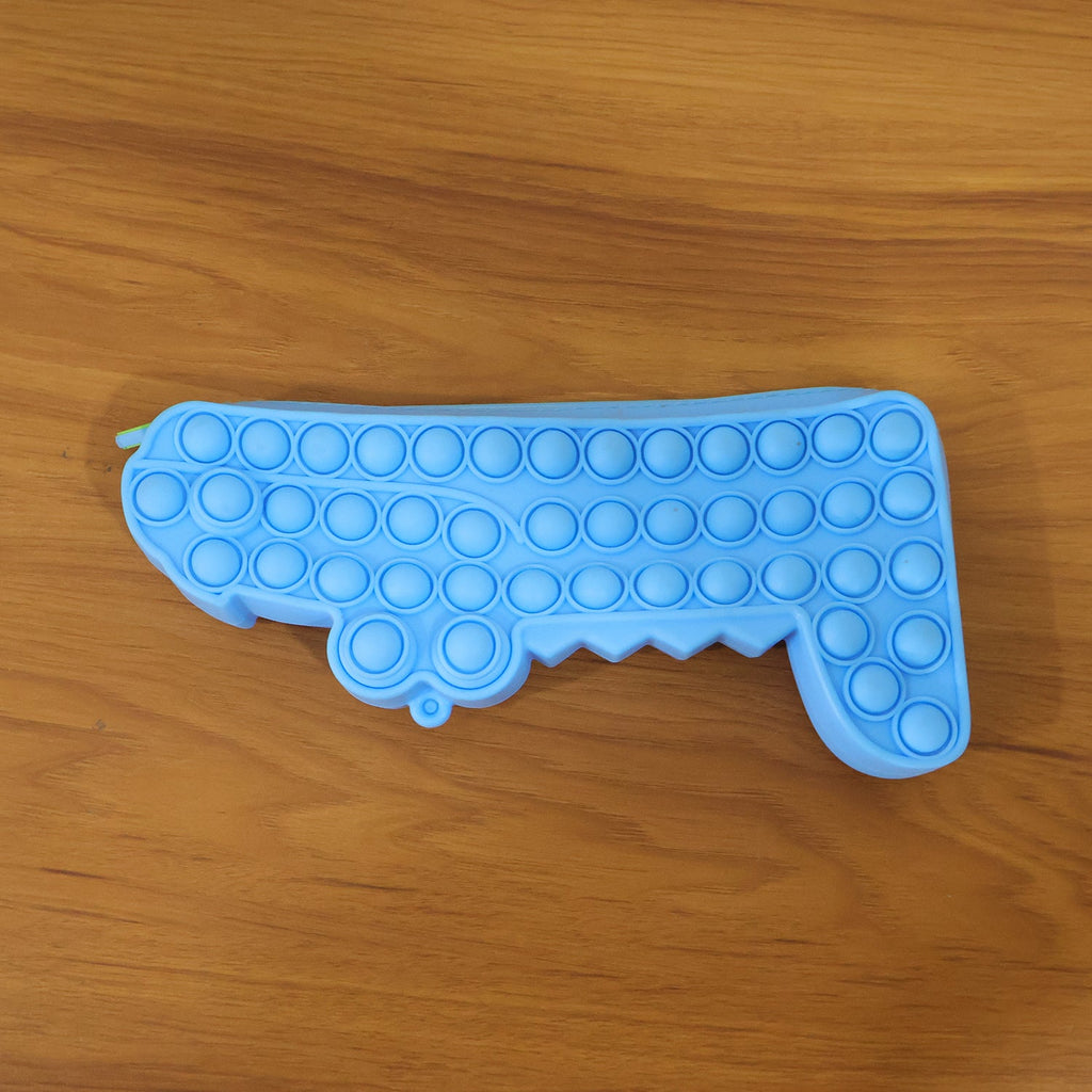 Pop It crocodile pencil pouch in use, playful setting