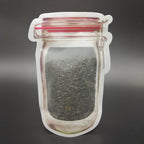 Close-up of the robust zipper closure on the reusable plastic food storage bag.