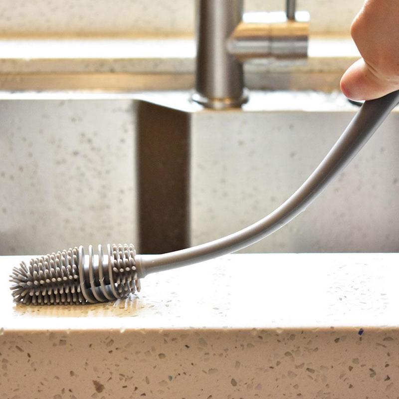 A bottle cleaning brush with a long handle, ideal for reaching the bottom of tall containers.