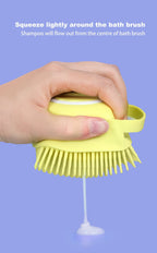 Top view of the easy-press button for the shampoo dispenser on the silicone bath brush.