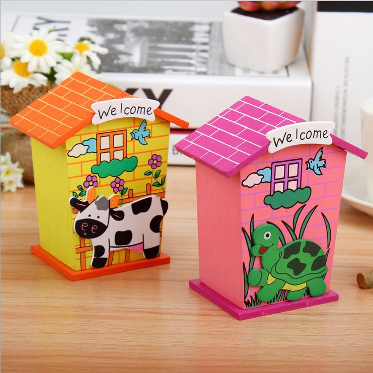 Close-up of the wooden piggy bank's roof with a coin slot for easy saving.