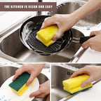 Hand holding the dual-sided scrub sponge for kitchen and sink cleaning tasks.