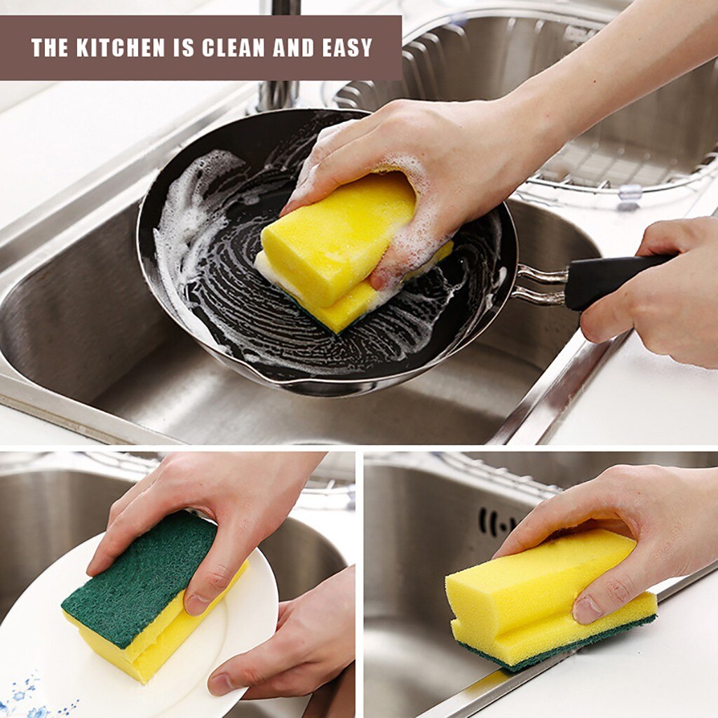 Hand holding the dual-sided scrub sponge for kitchen and sink cleaning tasks.