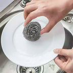 A single stainless steel scrubber, ready to make your kitchen cleaning tasks easier.