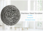 Round stainless steel scrubber shown in use, effortlessly removing tough stains from cookware.