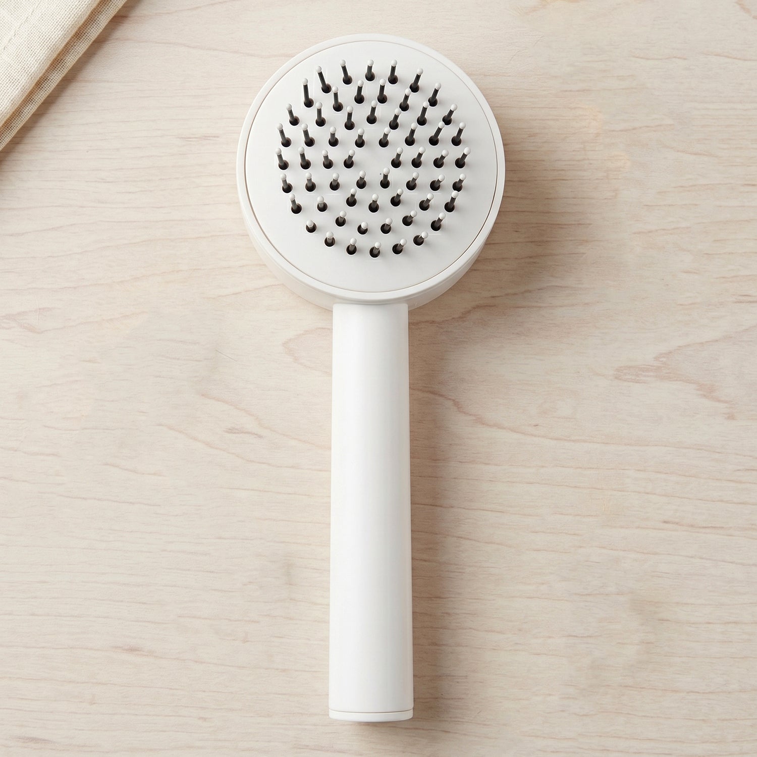 Person using the detangling air cushion brush for smooth, knot-free hair.