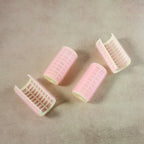 Neutral image showing hair curlers without styling context