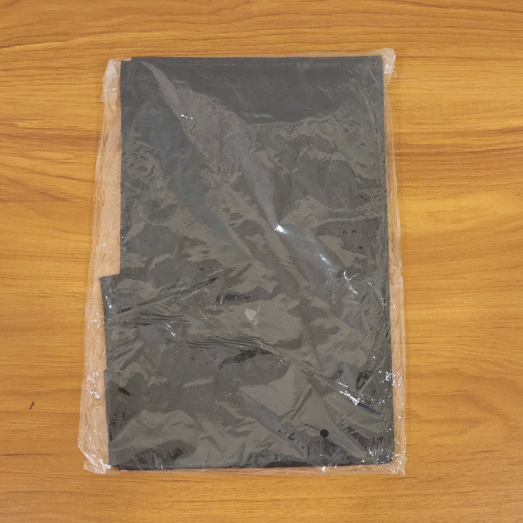 Salon cape used during barber grooming session for protection