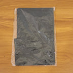 Salon cape used during barber grooming session for protection