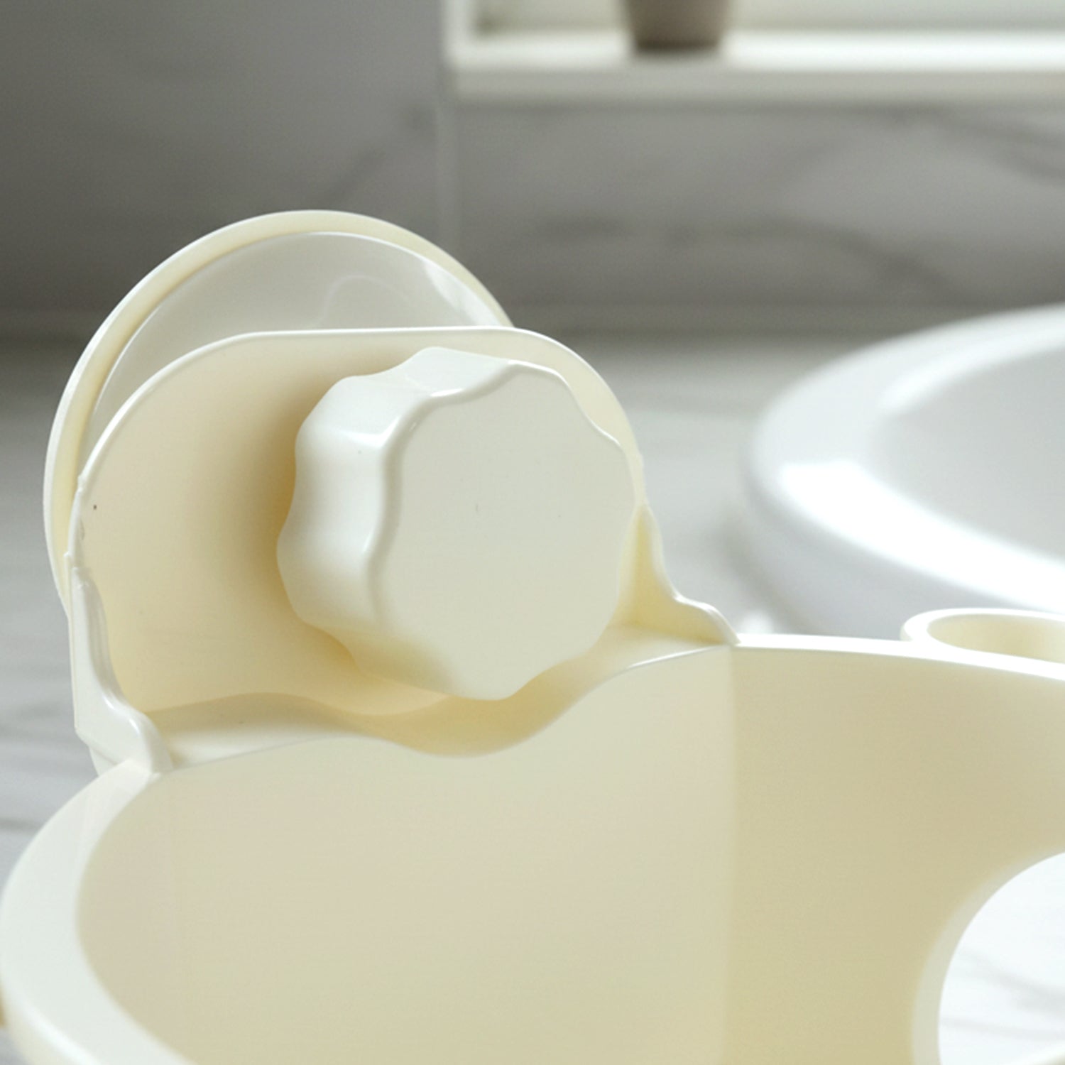Hair dryer holder showing suction cup back side