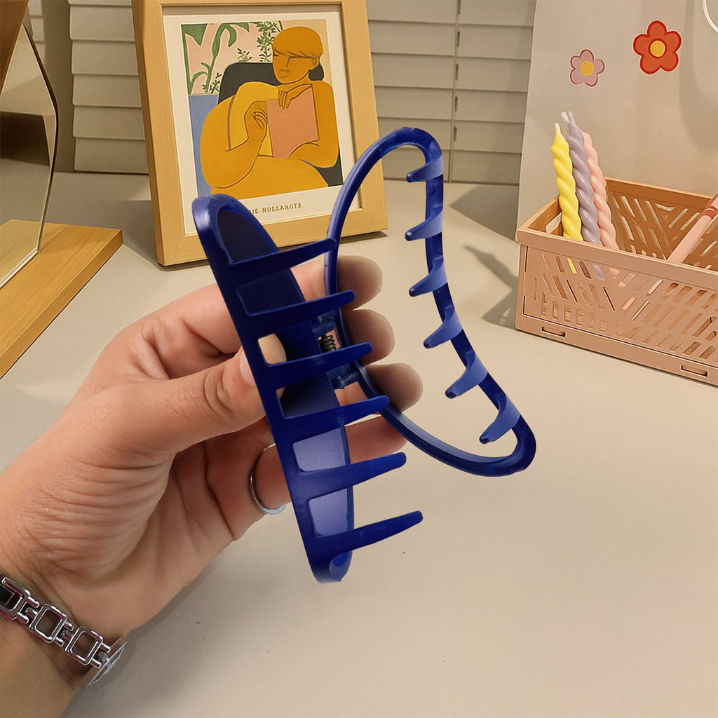 Hair clip holding hair back during face washing, plastic matte claw clip