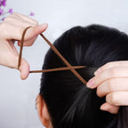 Ponytail elastic hair ties organized in a storage tube