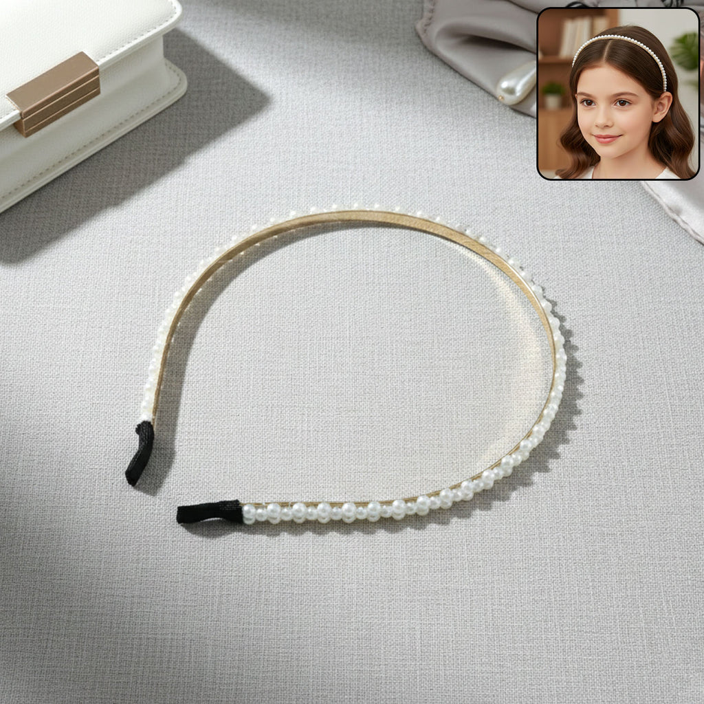 Pearl beaded slim golden metal hair band on white background