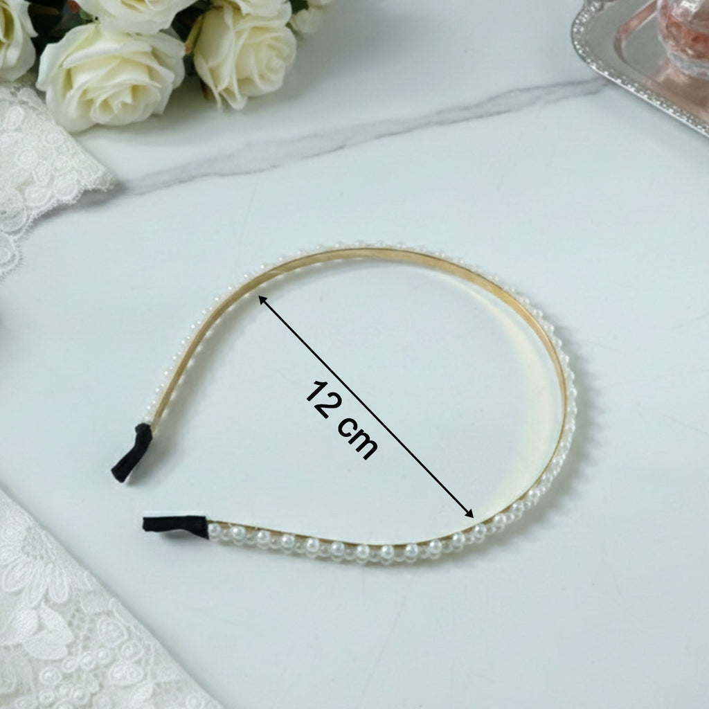 Decorative pearl studded gold hair band for festive occasions
