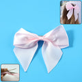 Elegant satin hair bow clip with soft fabric and metal clip for girls and women