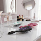 Close-up of kids hair brush with cartoon designs