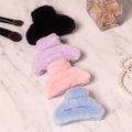 Big-size soft faux fur hair claw clip in pastel color showing plush texture and strong grip.