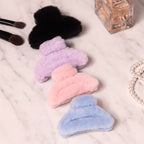 Big-size soft faux fur hair claw clip in pastel color showing plush texture and strong grip.