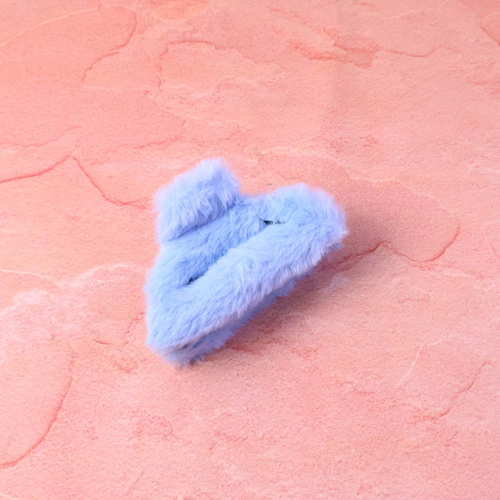 Heart shaped design soft faux fur hair claw clip adding fashion flair.