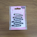 Model wearing snap hair clips styled in wavy hair