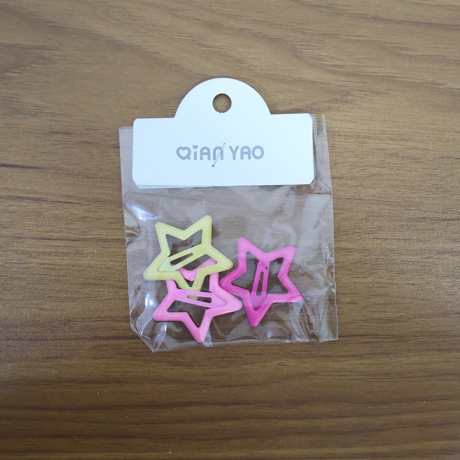 Star-shaped hair clips adorning a girl's elegant braided hairstyle.