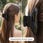 Black hair claw clip displayed on white background for close-up view
