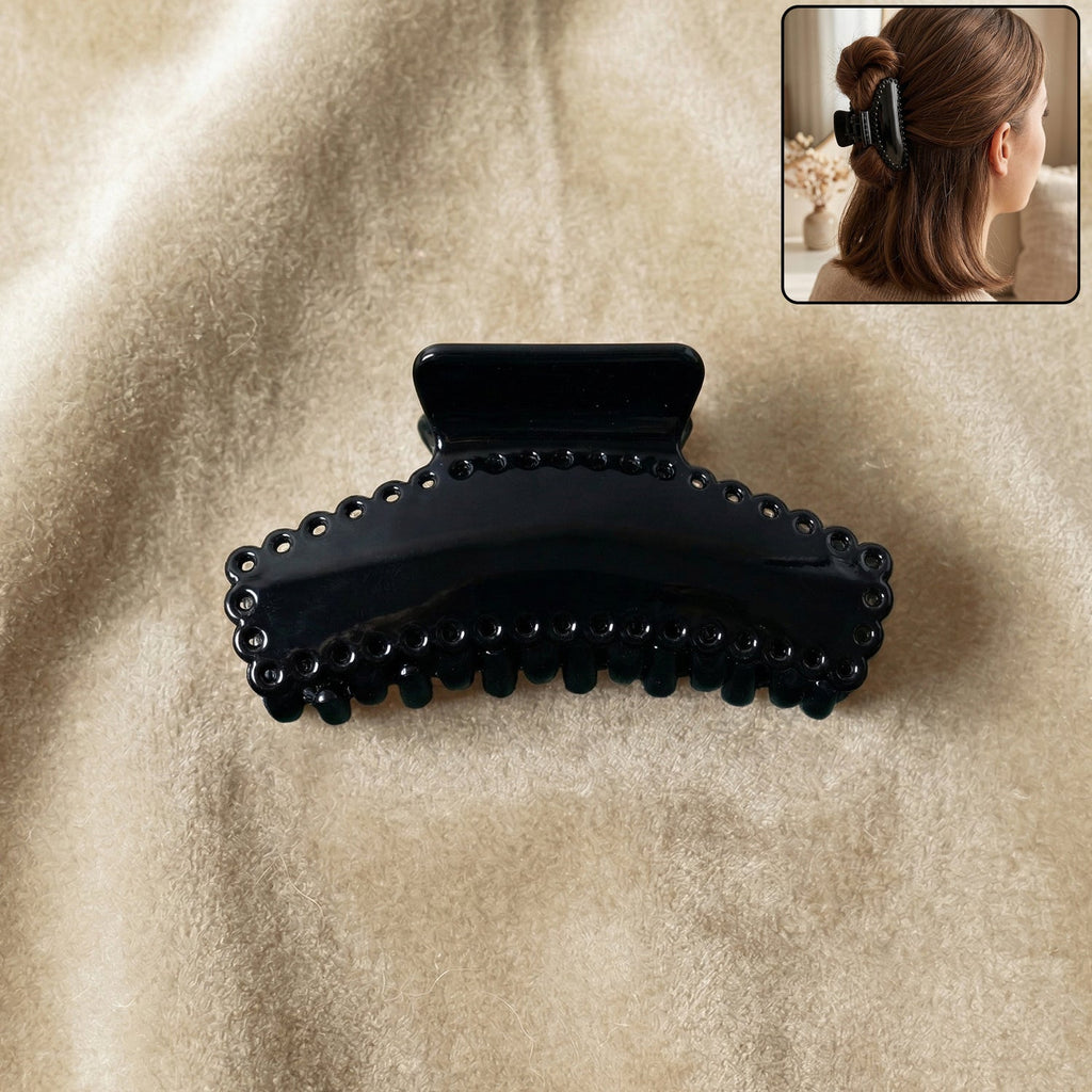 Elegant black hair claw clip holding hair securely during styling