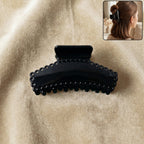 Elegant black hair claw clip holding hair securely during styling