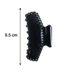 Size reference image of black hair claw clip for proportion estimation