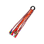 Braided hair extension featuring decorative tassels for festive looks
