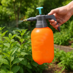 Close-up of the pump handle and spray nozzle on the garden pressure sprayer.