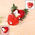 Heart shaped Valentine’s gift box featuring a teddy bear and scented roses