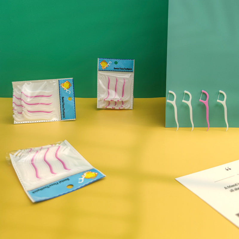 Individual dental floss pick showing the integrated toothpick for complete oral care.
