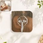 Brushed steel floral design wall hook on white background with strong adhesive