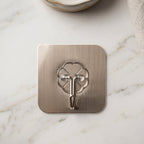 Multipurpose self-adhesive wall hook holding keys and small items