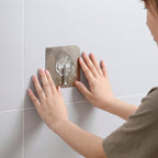Self-stick metal floral design wall hook in use for hanging keys