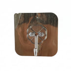 Adhesive brushed steel flower wall hook mounted on tile wall
