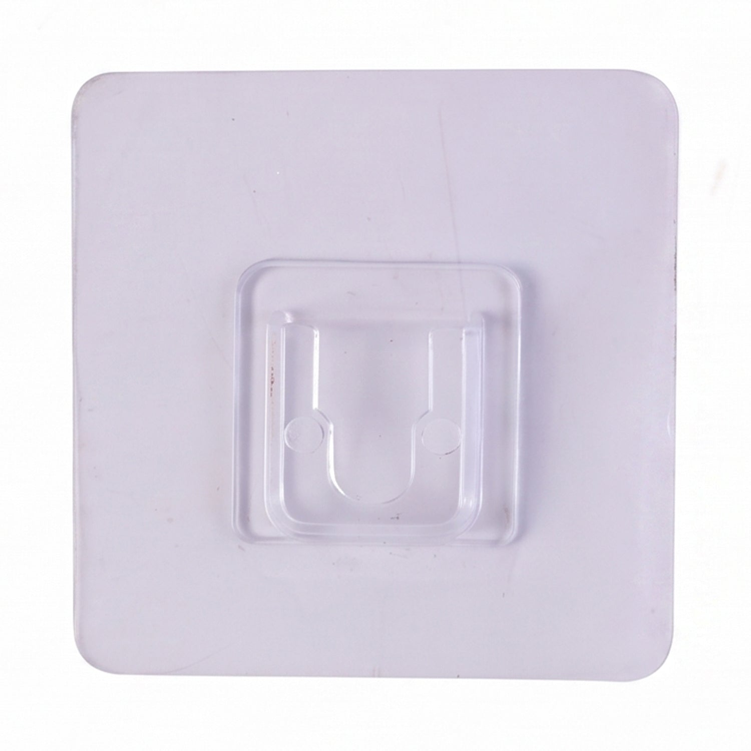 Transparent wall hook attached to a smooth surface for organization.