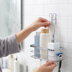 Self adhesive wall hook holding kitchen utensils
